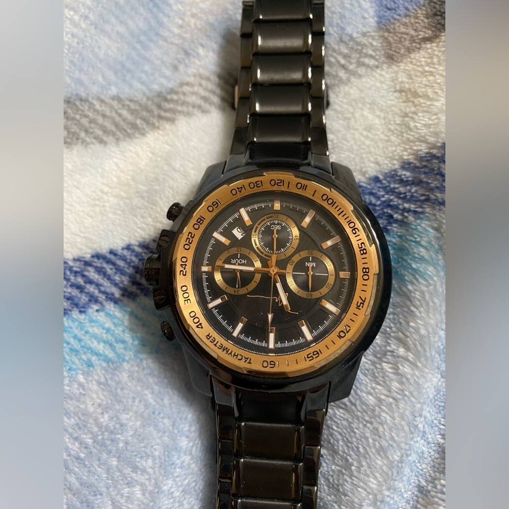 This is a men’s Marc Anthony black stain steel watch.